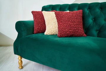 green sofa and pillows